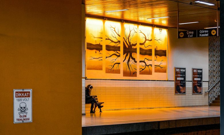Close-up of a doctor examining a patient's throat with a tongue depressor in a medical office
