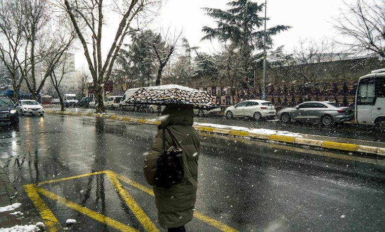 Kocaelispor and Göztepe players in action on the field during a football match, with a stadium crowd in the background